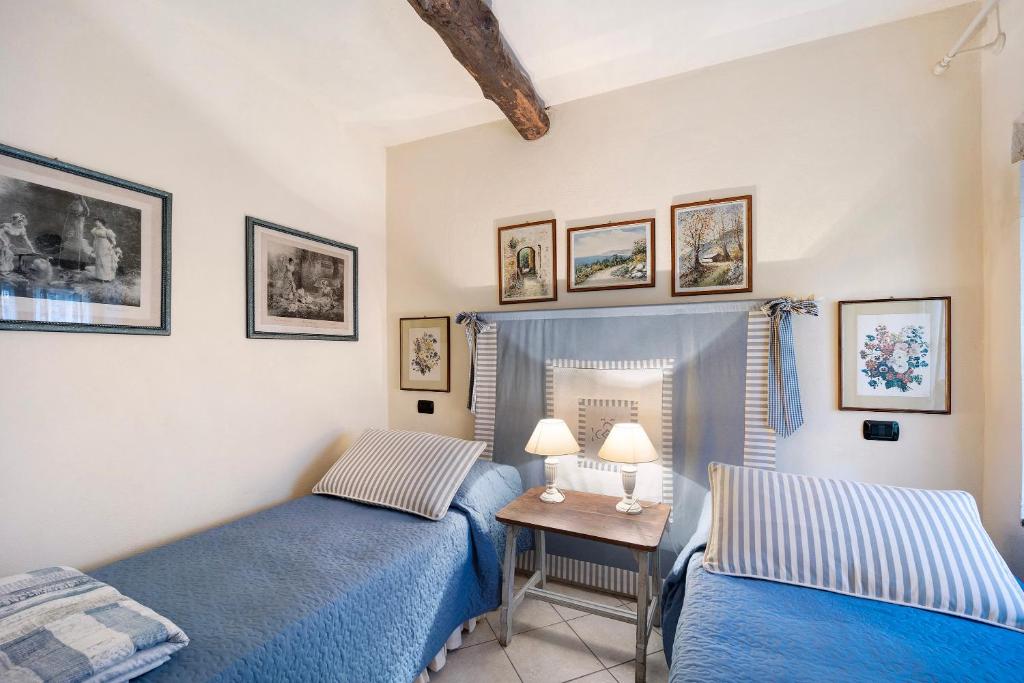 Postel nebo postele na pokoji v ubytování Casa dei Tigli