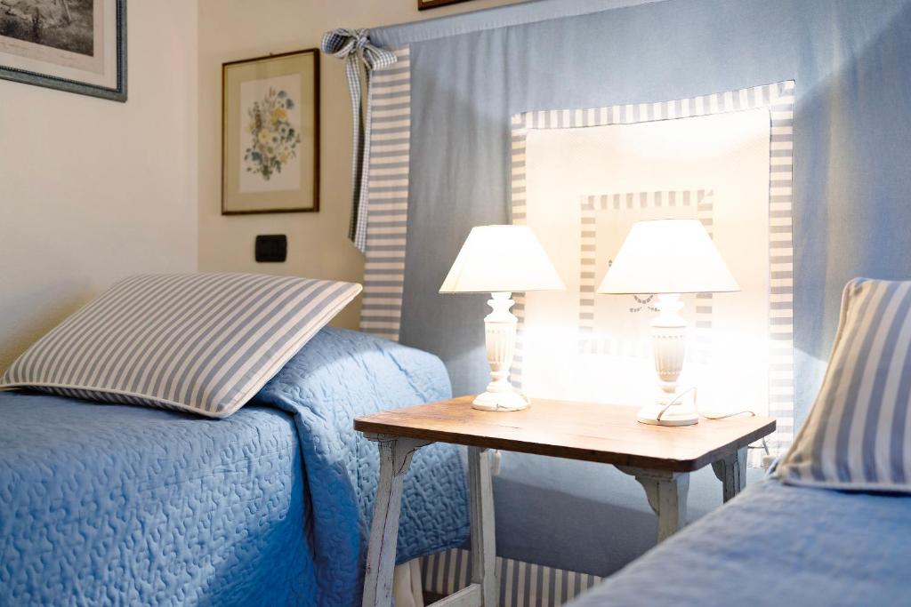 Postel nebo postele na pokoji v ubytování Casa dei Tigli