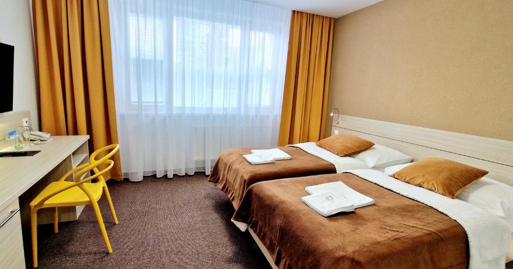 Postel nebo postele na pokoji v ubytování Hotel Kristína