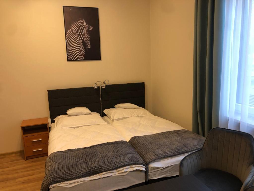 Posteľ alebo postele v izbe v ubytovaní Apartamenty JN Poznań Rzeczna 4