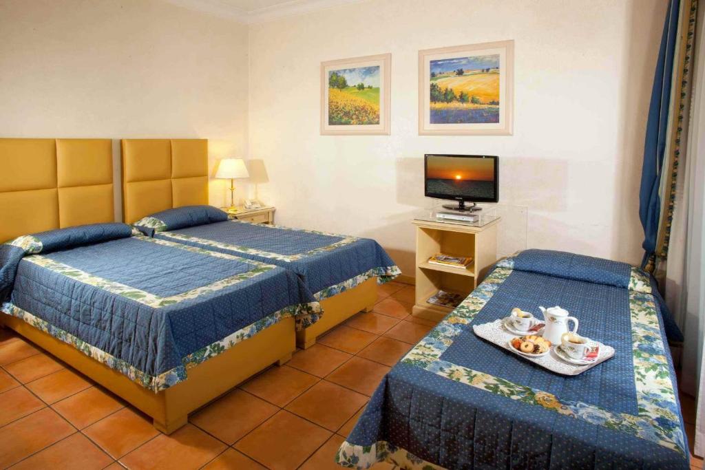 Uma cama ou camas num quarto em Hotel Piccolo Borgo