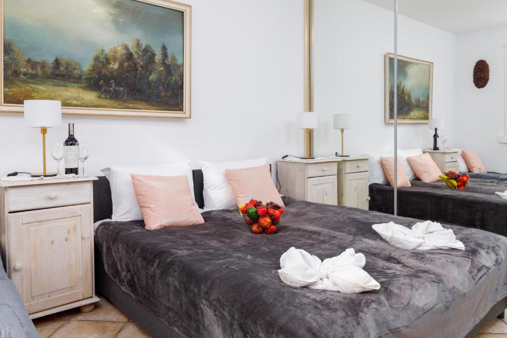 a bedroom with two beds with fruit on it at Apartment with Veranda Toruńska Pobierowo by Renters in Pobierowo