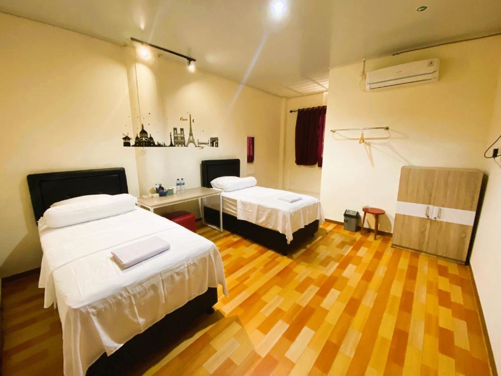 Postel nebo postele na pokoji v ubytování IVI Hotel
