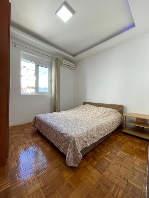 Postel nebo postele na pokoji v ubytování Apartmani centar ulcinj