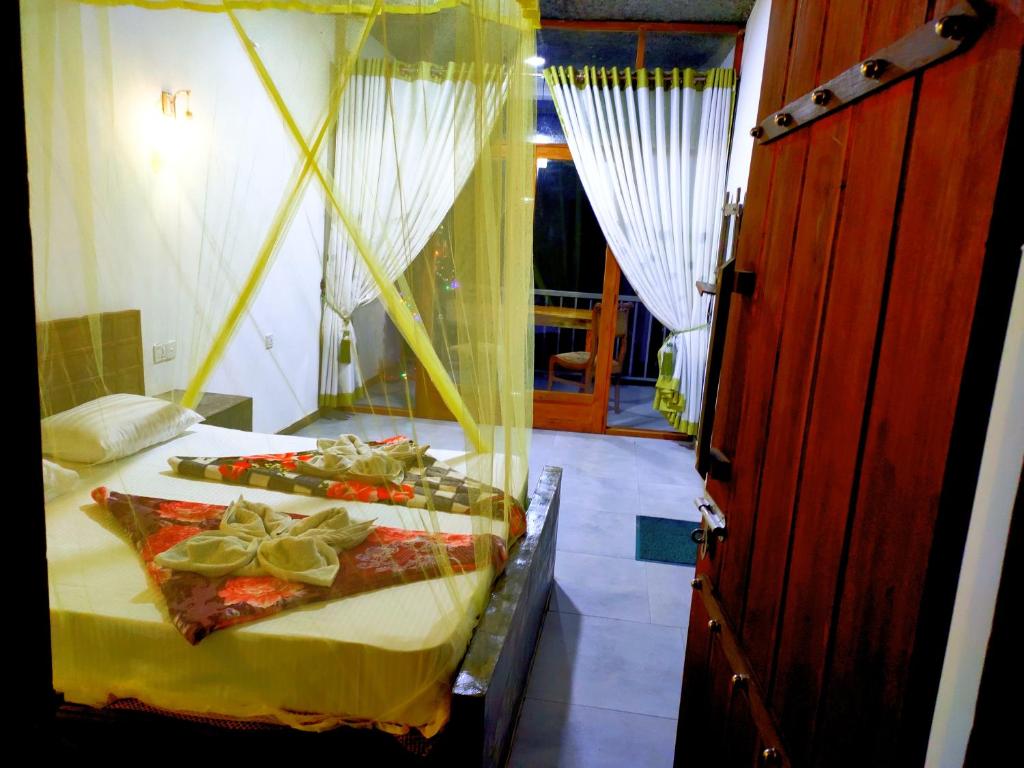 Postel nebo postele na pokoji v ubytování Rock Paradise Homestay