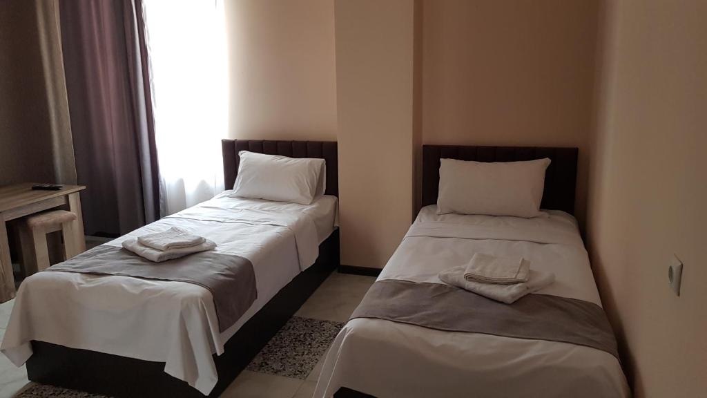Postel nebo postele na pokoji v ubytování RP HOTEL (NEW)