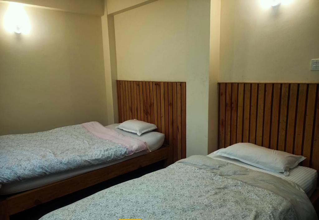 Кровать или кровати в номере Nirwana kutee