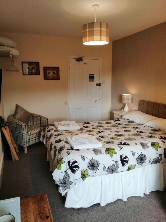 Postel nebo postele na pokoji v ubytování Lion Hotel