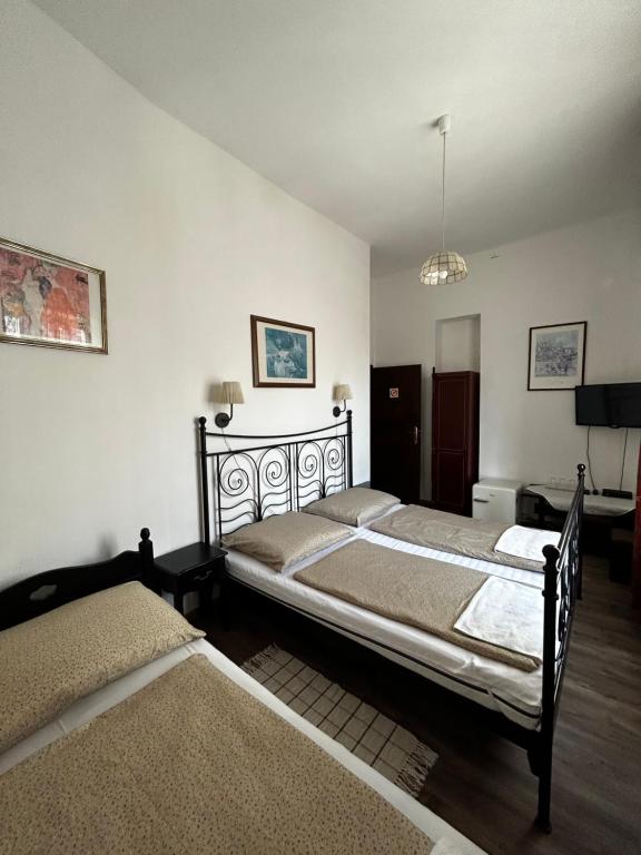 Posteľ alebo postele v izbe v ubytovaní Kis Gellért Guesthouse