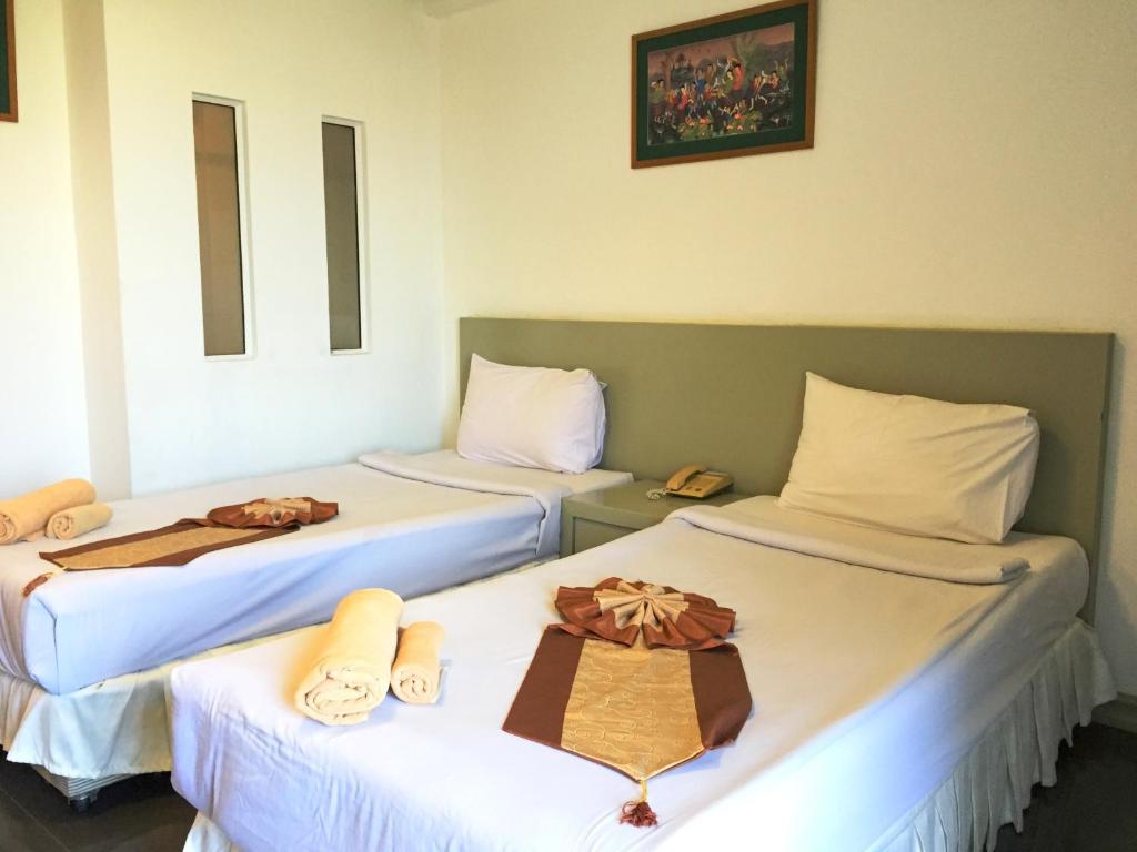 Postel nebo postele na pokoji v ubytování Tanawit Hotel & Spa