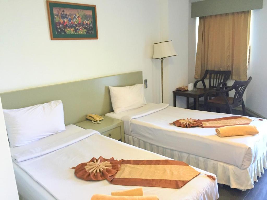 Postel nebo postele na pokoji v ubytování Tanawit Hotel & Spa