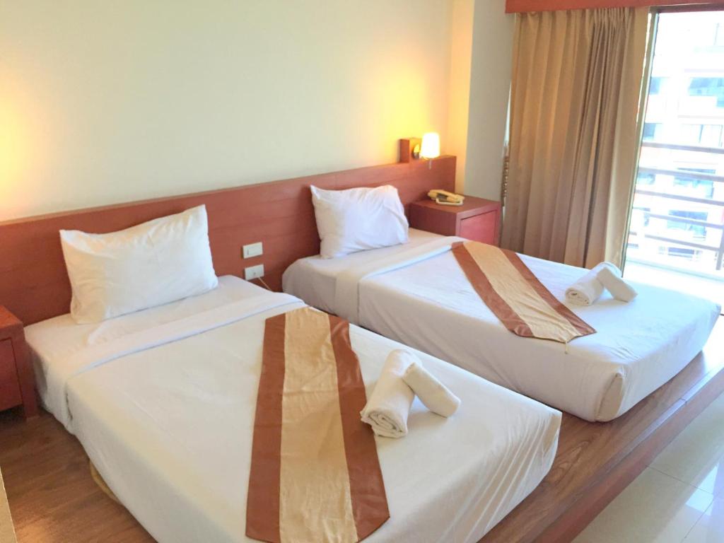 Postel nebo postele na pokoji v ubytování Tanawit Hotel & Spa