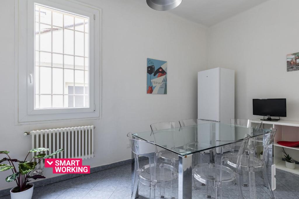 A television and/or entertainment centre at Alessandrini Apartment alla Finestrella by Wonderful Italy