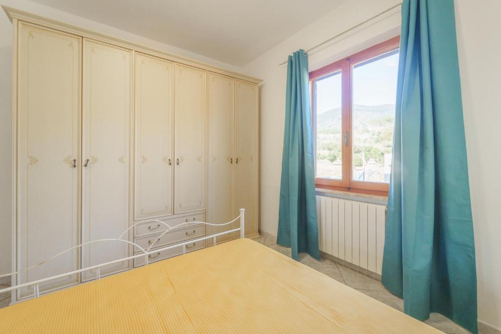 Postel nebo postele na pokoji v ubytování Villa Mimosa con Piscina - Goelba
