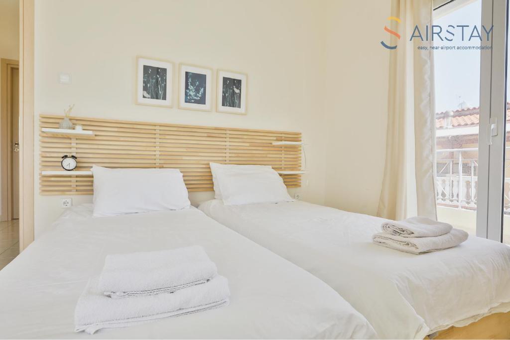 Postel nebo postele na pokoji v ubytování Nautilus Apartments Airport by Airstay