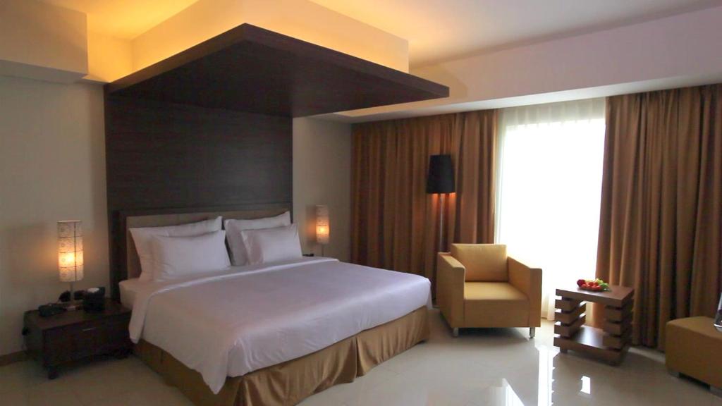 Postel nebo postele na pokoji v ubytování Sakura Park Hotel & Residence