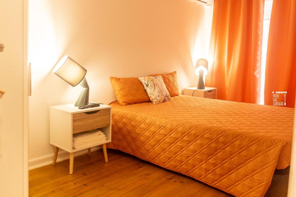 Postel nebo postele na pokoji v ubytování Pátio das Cantigas