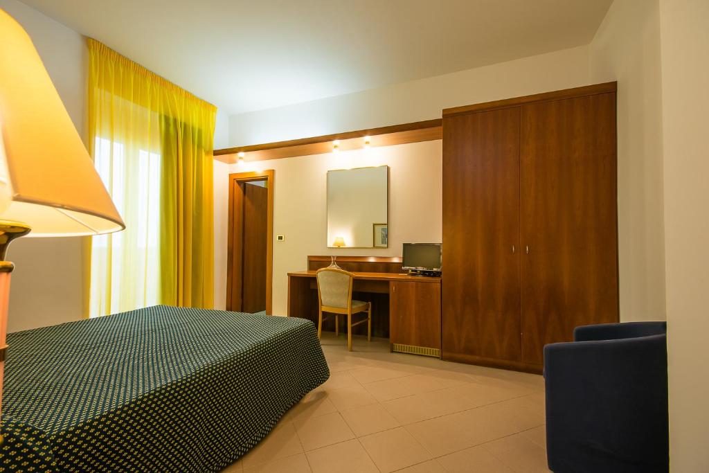 Postel nebo postele na pokoji v ubytování HOTEL SOLE