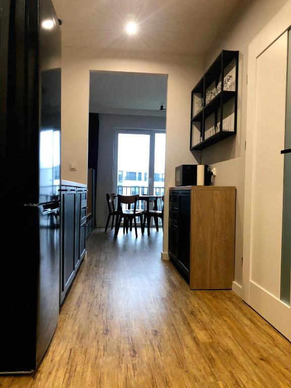 Kuchyňa alebo kuchynka v ubytovaní Apartament Sky Jastrzębia Góra