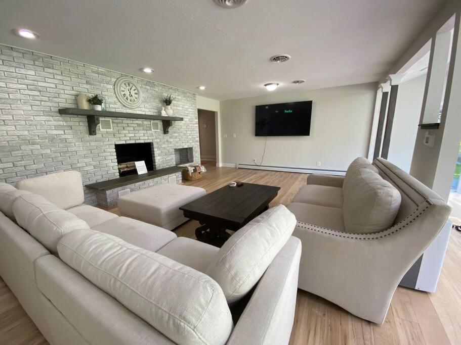 a living room with white furniture and a fireplace at Mexico Point Ranch in Mexico