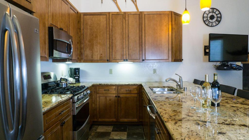 a kitchen with wooden cabinets and a counter top at Ski Trails 4058 in Truckee