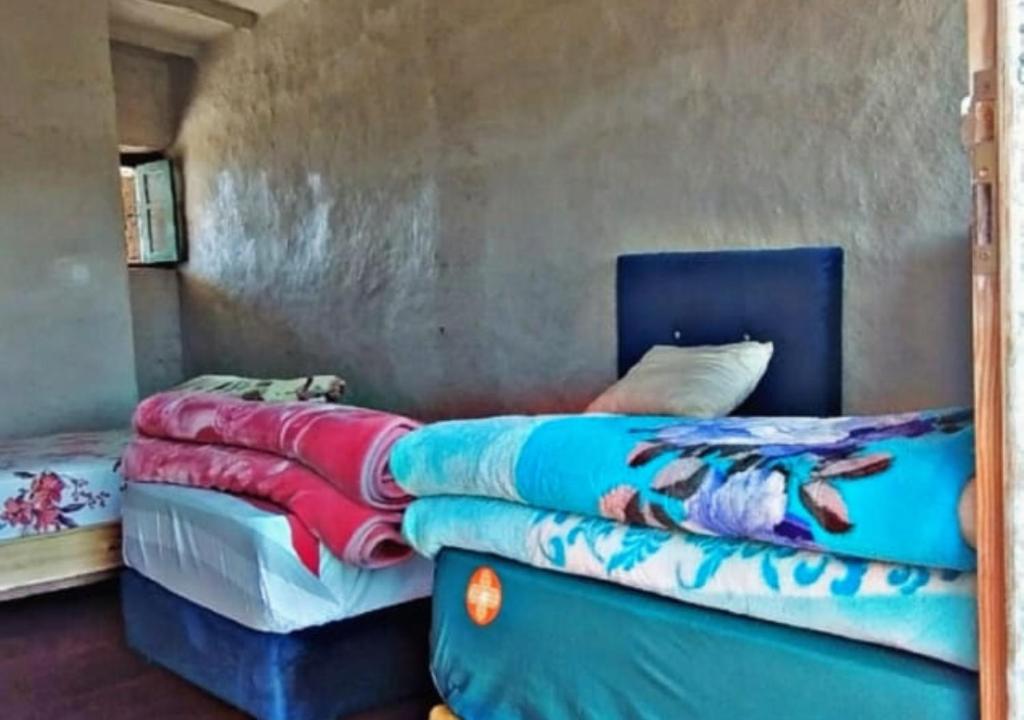 Postel nebo postele na pokoji v ubytování La Belle Etoile
