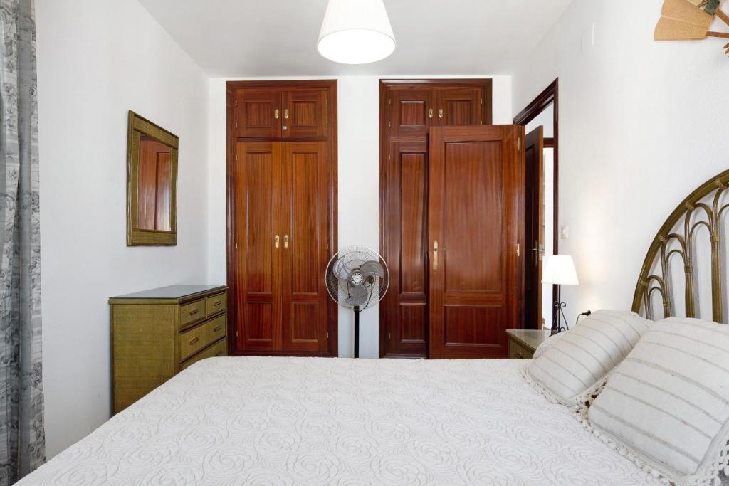 Łóżko lub łóżka w pokoju w obiekcie Apartamento Mercedes