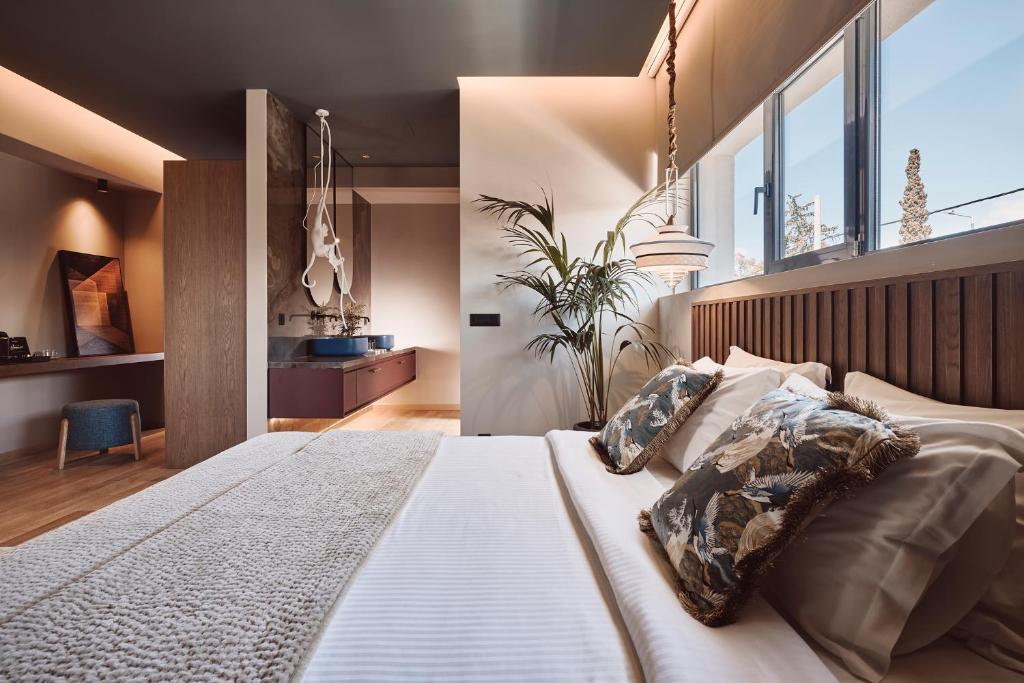 Postel nebo postele na pokoji v ubytování Cama Luxury Suites Glyfada