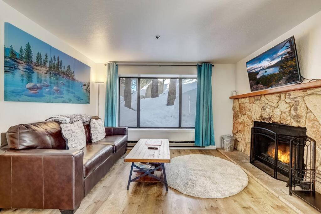 a living room with a couch and a fireplace at Heavenly Mountain Lake Retreat Near Hiking & Bikin in Stateline