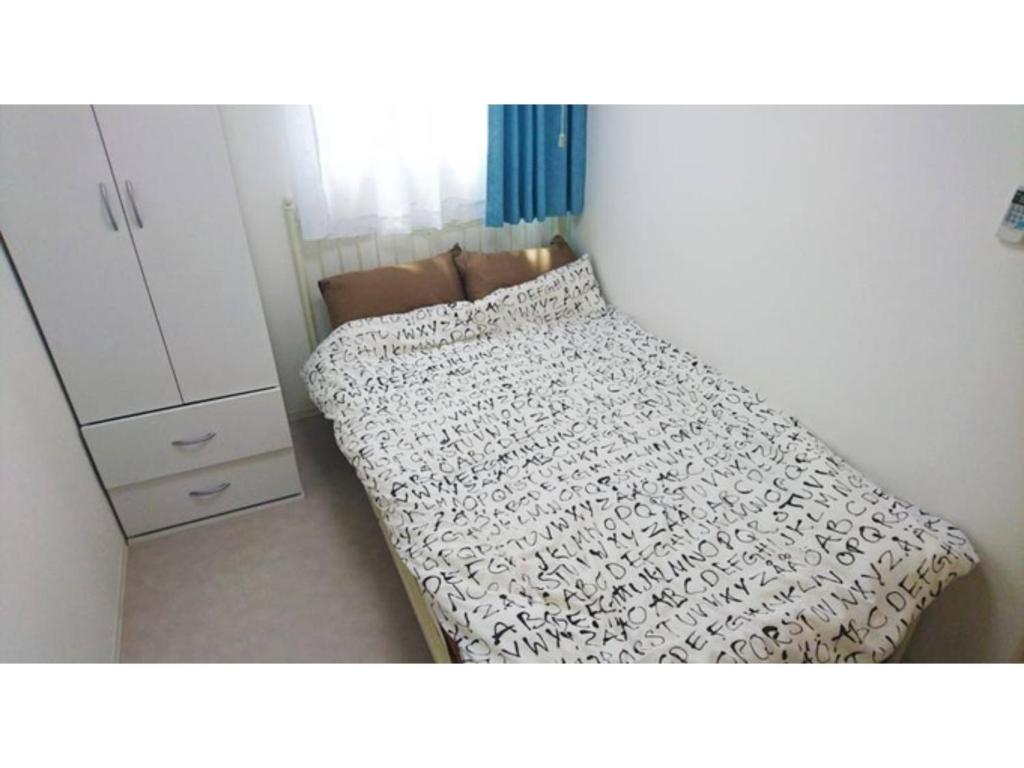 Кровать или кровати в номере Plage Yuigahama - Vacation STAY 00222v