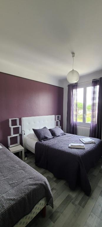 Postel nebo postele na pokoji v ubytování Hôtel l'Etoile