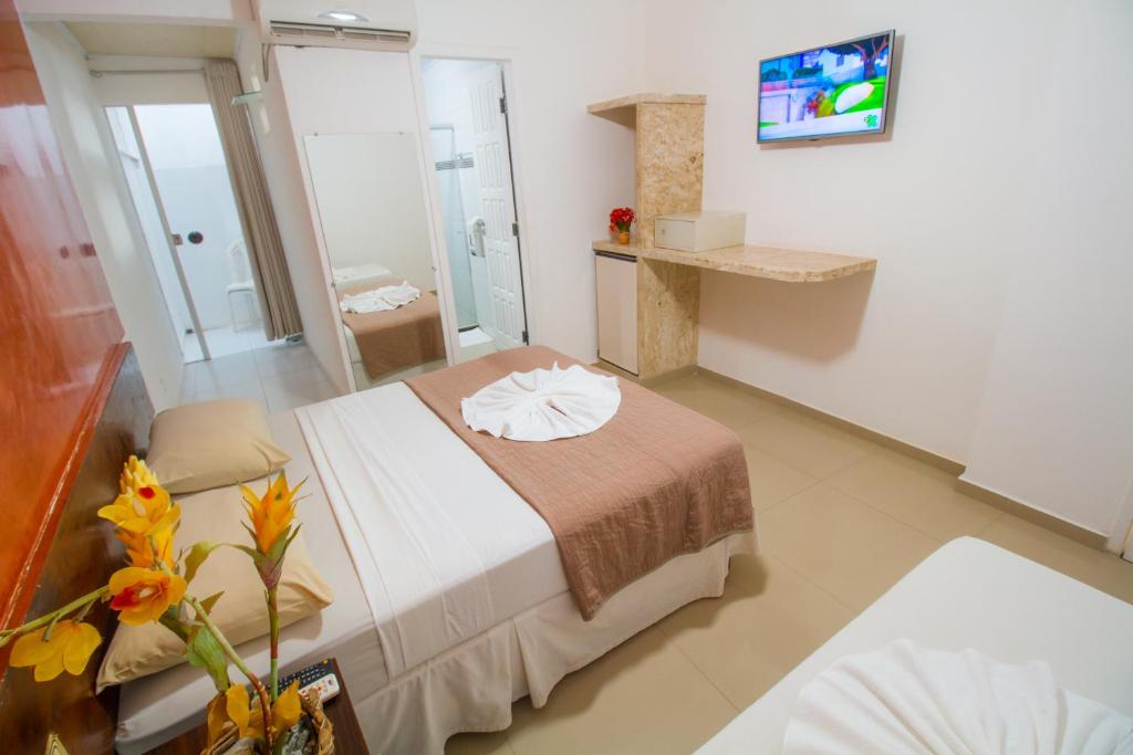 Postel nebo postele na pokoji v ubytování Shangrilá - Rede Soberano
