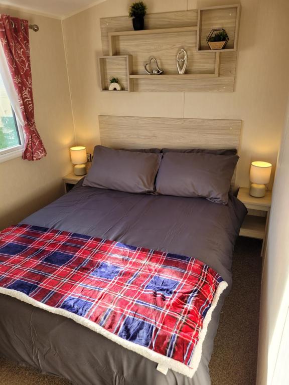 Ένα ή περισσότερα κρεβάτια σε δωμάτιο στο Seawick Holiday Park