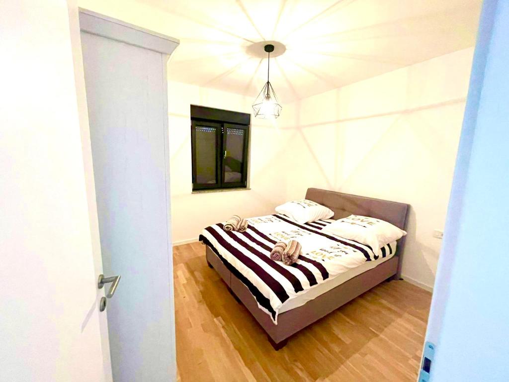 a bedroom with a bed in a room at Apartment Aron in Biograd na Moru