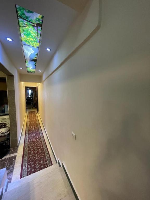 a hallway with a ceiling with a stained glass window at Way to kamet in Alexandria