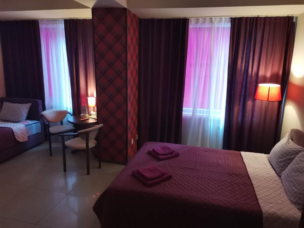 Postel nebo postele na pokoji v ubytování Westend Hotel Kyiv