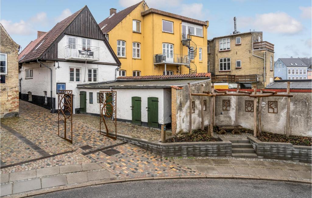 a group of buildings in a city with a street at Beautiful Apartment In Aabenraa With Wifi And 2 Bedrooms in Aabenraa