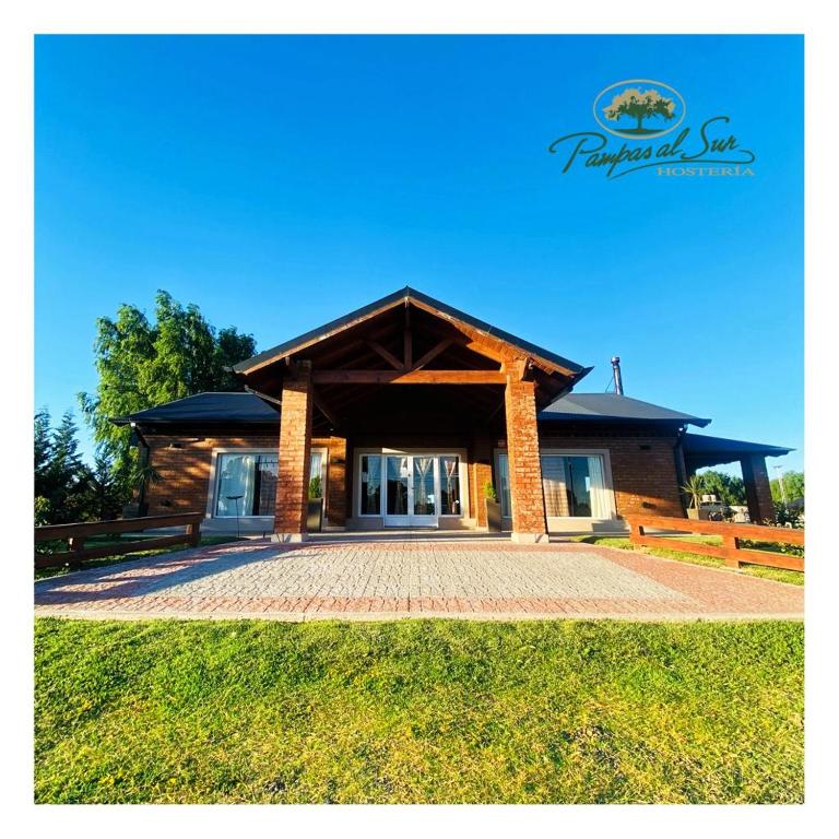 a house with a pavilion in front of it at Pampas al Sur in Colorado River