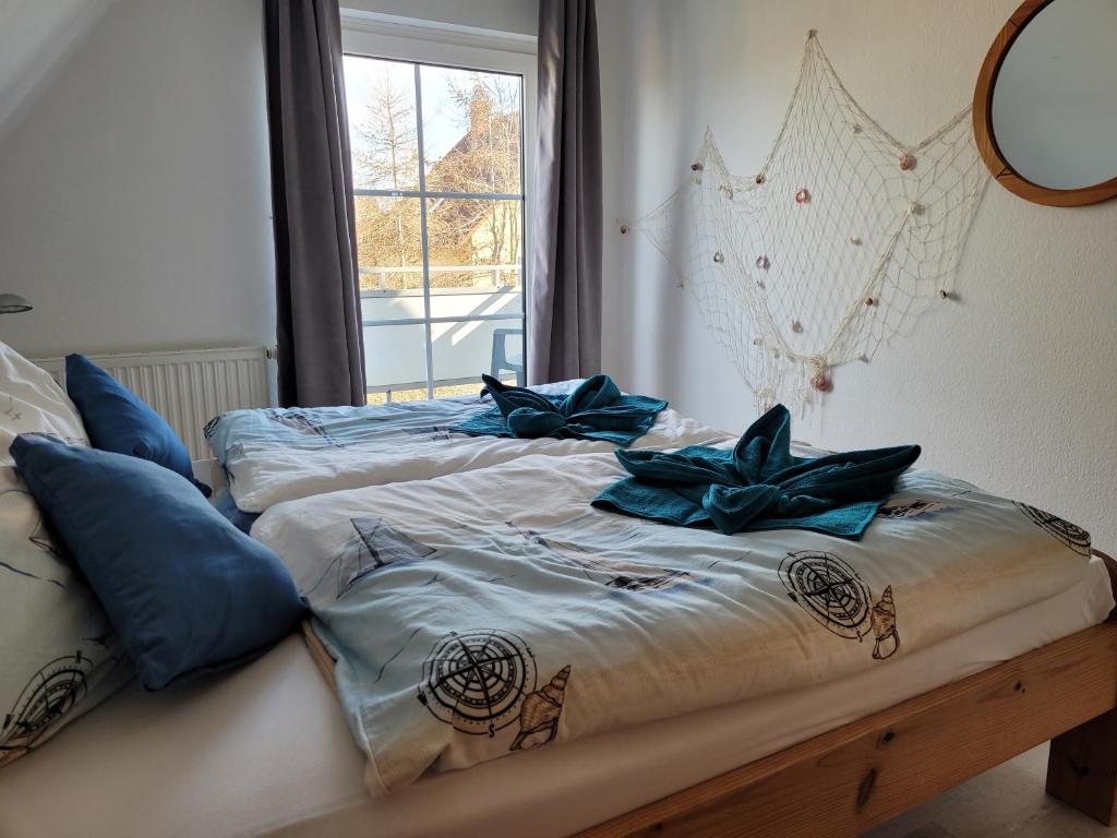 Postel nebo postele na pokoji v ubytování Ostseeträume