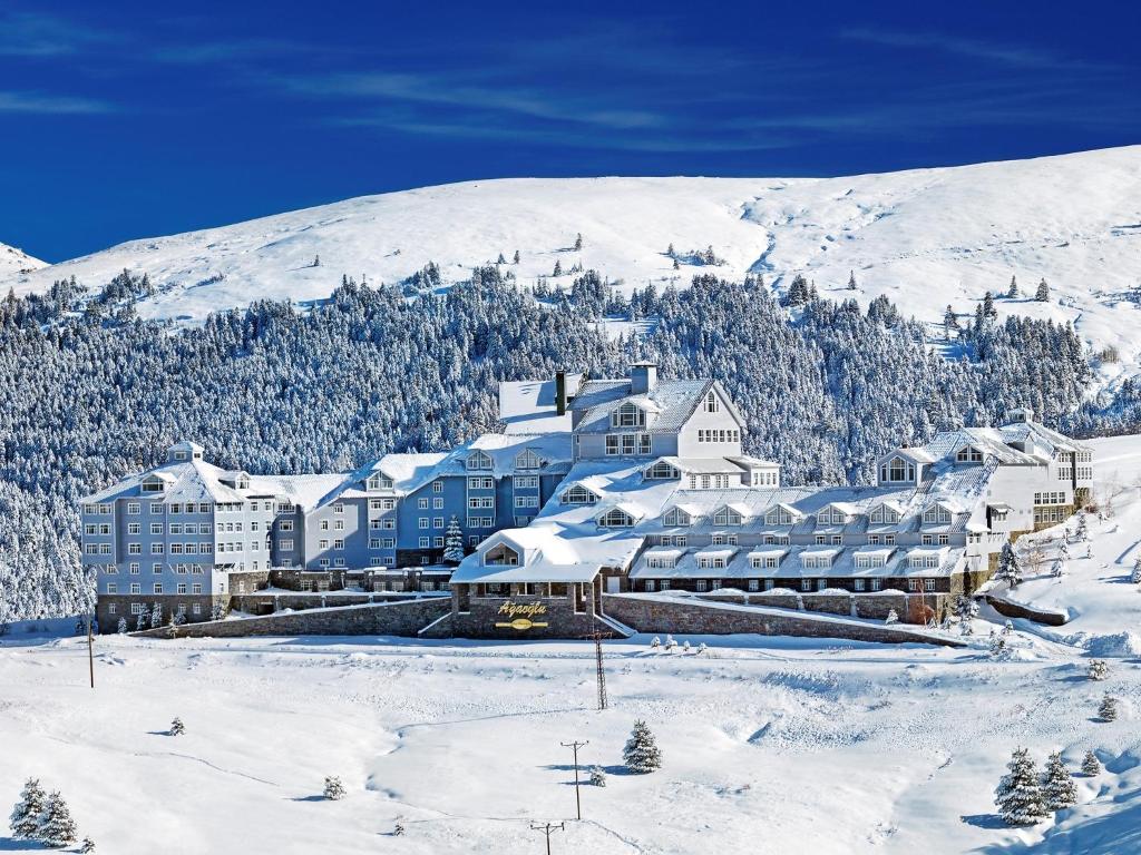 a large building in the snow on a mountain at Ağaoğlu My Mountain in Uludag