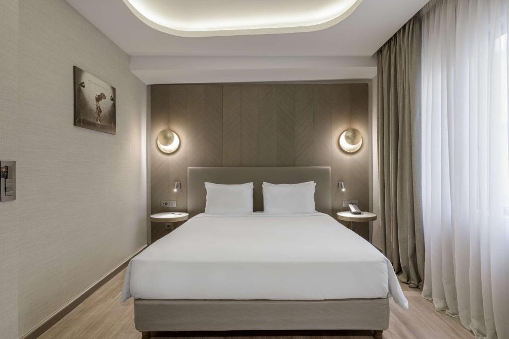 Postel nebo postele na pokoji v ubytování Radisson Blu Park Hotel Athens