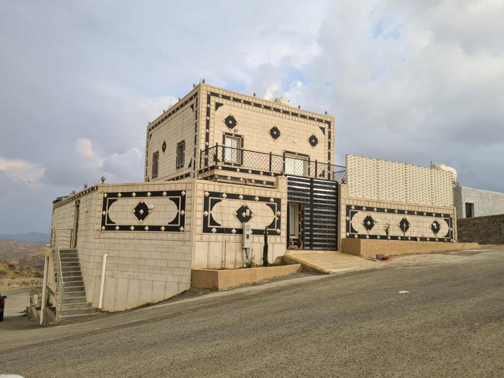 a large building on the side of a road at فيلا ميسرة الهدا in Al Hada