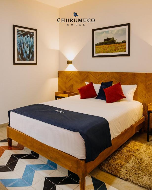 Postel nebo postele na pokoji v ubytování HOTEL CHURUMUCO