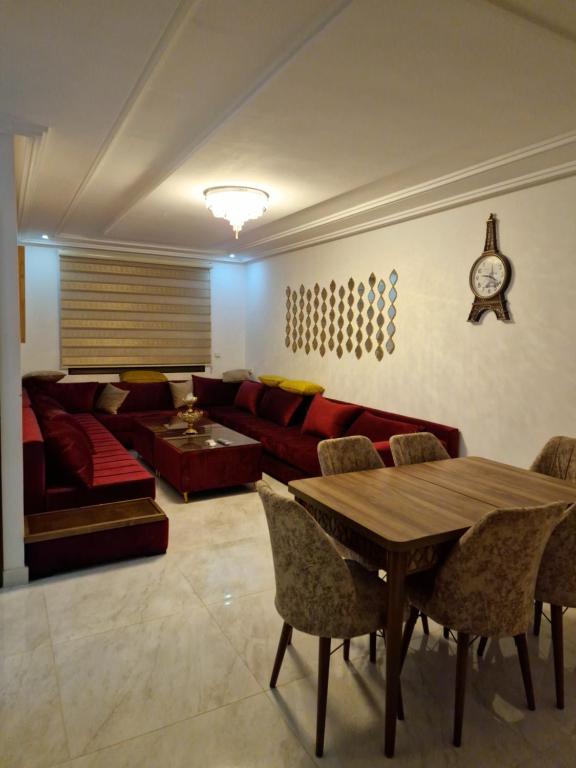 a living room with a couch and a table at Nice appartment nador al jadid in Nador