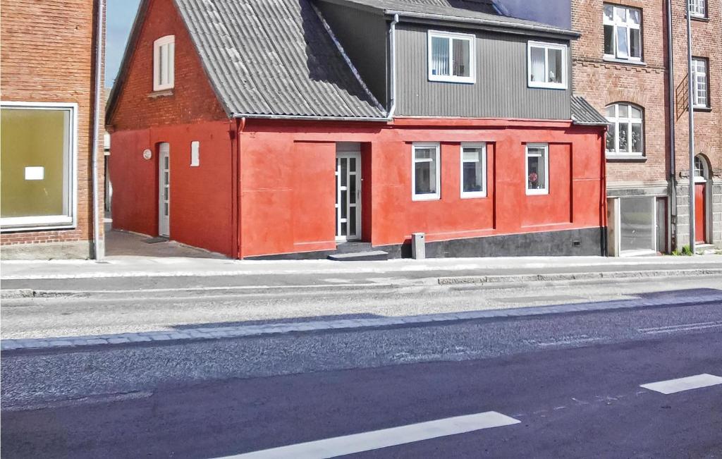 a red building on the side of a street at Gorgeous Apartment In Randers C With Wifi in Randers