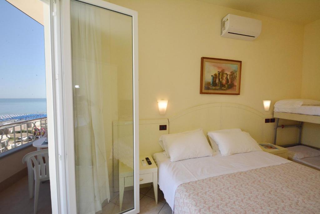 Postel nebo postele na pokoji v ubytování Hotel Fenice Gluten Free