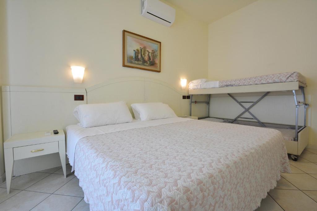 Postel nebo postele na pokoji v ubytování Hotel Fenice Gluten Free