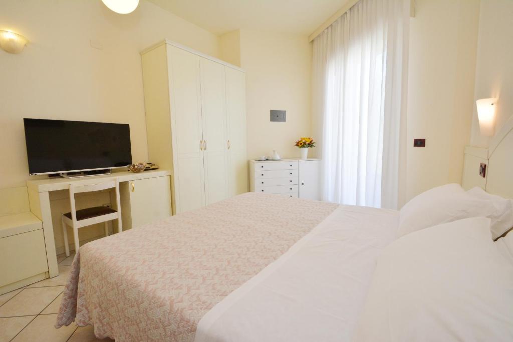Postel nebo postele na pokoji v ubytování Hotel Fenice Gluten Free
