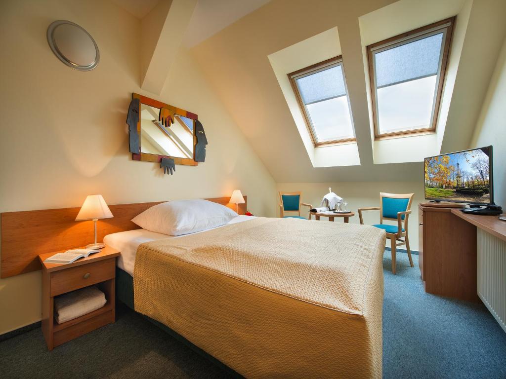 TV a/nebo společenská místnost v ubytování EA Hotel Tosca