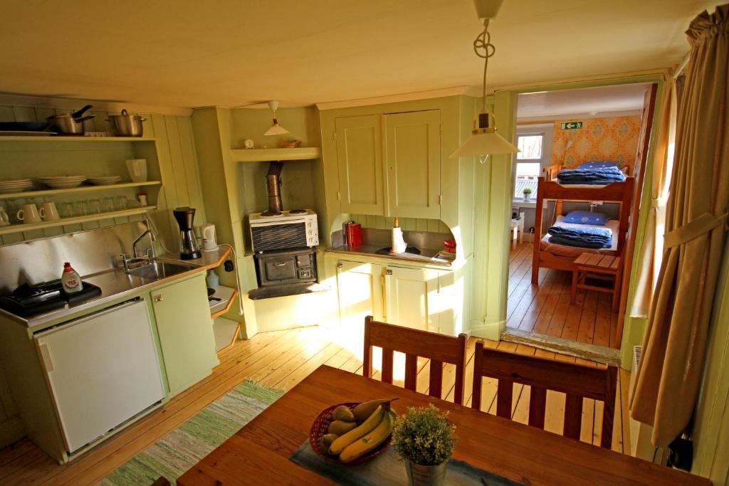 a kitchen with a table with bananas on it at Mallboden Café & Vandrarhem in Motala
